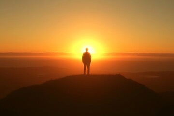 Silhouette of a Person Watching a Sunrise