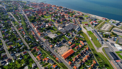 Arial panoramic view of the old town of the coast city Logstor in Denmark on a sunny spring day

