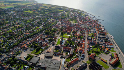 Arial panoramic view of the old town of the coast city Logstor in Denmark on a sunny spring day

