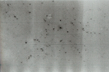 Blank grained film strip texture background with heavy grain, dust and light leak