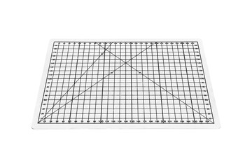 A white cutting mat with a white grid is isolated on transparent background.