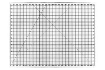 A big white cutting mat with a white grid is isolated.