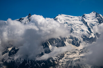 Aerial view of Glaciers cascading down the peak of  Le Mont Blanc France - Snow capped peaks on the...