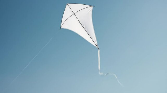 Kite Flying High Against a Clear Blue Sky Peaceful Outdoor Activity