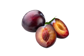 Fresh ripe plums whole and sliced plum halves with pit isolated on black background