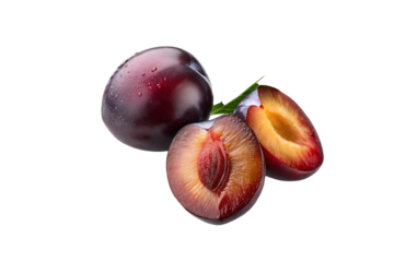 Fresh ripe plums whole and sliced plum halves with pit isolated on black background