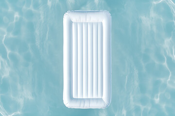 Minimalist White Pool Float on Clear Water