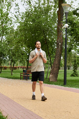Sporty young man enjoying a workout in a scenic outdoor park setting