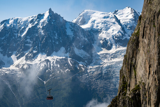 Aerial view of Glaciers cascading down the peak of  Le Mont Blanc France - Snow capped peaks on the tallest mountain in the French Alps