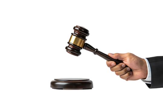 Gavel in Hand Ready to Strike on Sound Block with Black Background Symbolizing Justice and the Legal System