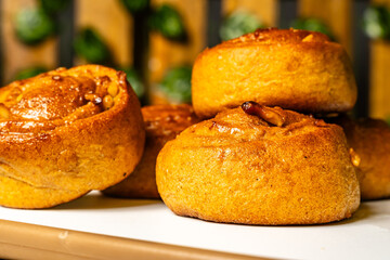 horizontal photo side view close-up of whole wheat artisan bread mogolla style with peanuts, sweetened with honey, in a healthy vegetarian restaurant in Colombia