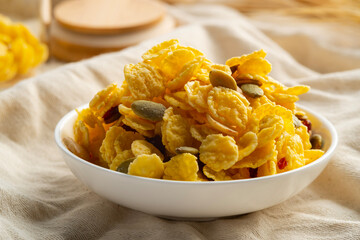 Caramel cornflakes mixed with grains in a plate.snack food.