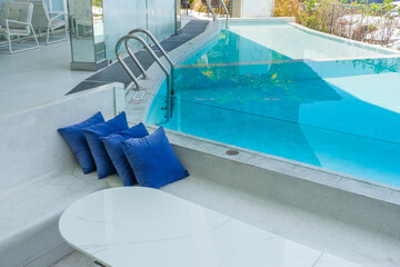Empty swimming pool with table and chairs in summer,sofa resort neary sea and beach,restaurant and...