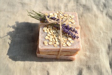 Handmade Oatmeal Soap with Lavender Tied with Twine on Linen