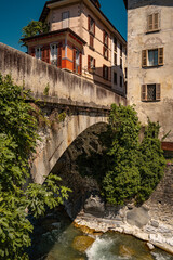 Historic Town of Chiavenna with Colorful Riverside Buildings and Stone Bridges: Scenic Italian...