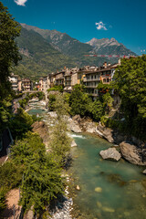 Historic Town of Chiavenna with Colorful Riverside Buildings and Stone Bridges: Scenic Italian...