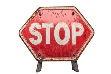 Stop sign on a white background showcasing weathered texture and worn edges, symbolizing road safety and traffic regulations in urban areas