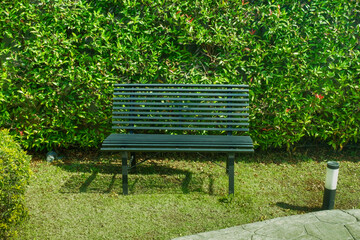 Folding camping chair and green grass,chairs and picnic table around,Outdoors camping adventure concept.