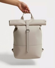 Minimalist Roll-Top Backpack Held by Hand on Neutral Background for Product Display