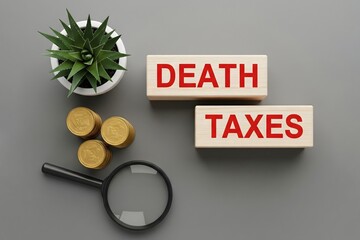 Death taxes concept. Wooden blocks with inscription and coins. Taxes that are applied when someone dies, usually on the money or property they leave behind. 