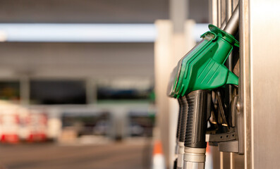 Drivers filling their cars with fuel at gas petrol station, utilizing various pumps that supports...