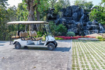 Golf cart at the golf course in Summertime,over nice green and blue sky,vacation and rest...