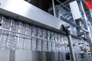 Plastic Bottle Production Line in Modern Factory with Empty Containers on Automated Conveyor System