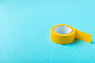 Insulating tape on a bright colored background. Set of different colors insulating tape. Reel...