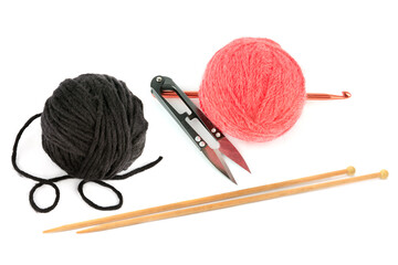 Balls of yarn, knitting needles, scissors and crochet hook isolated on white background.