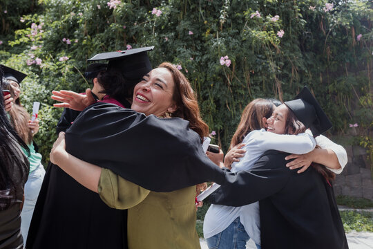 young Latin graduates students group celebrating at University campus in Mexico Latin America, portrait of hispanic people at college 