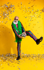 Full size vertical photo of extravagant man dancing disco ball wear shiny costume isolated on...