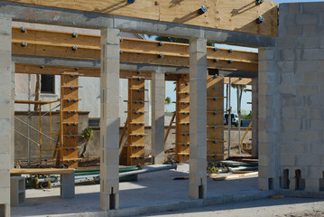 Modern Construction Framework with Wooden Beams and Steel Supports on Sunny Day in Florida....