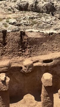 Karahan Tepe, Ancient stone statues in archeological site of Karahan Tepe in Sanli Urfa city, Turkey. Oldest Temple of the World, is UNESCO World Heritage. carved stone ruins in  Turkey. vertical 4k