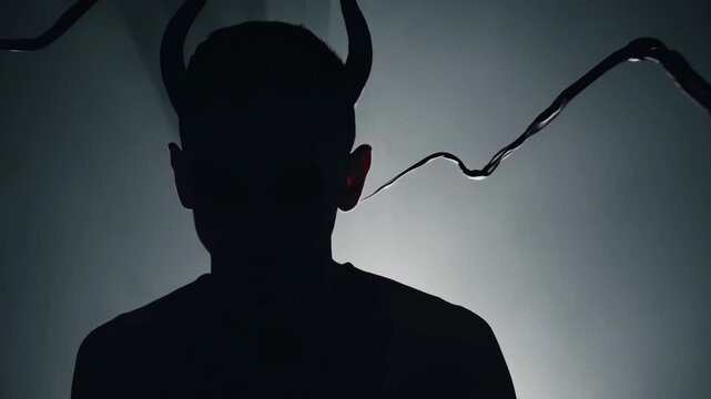 A whispering, translucent demonic silhouette behind a human head, smoke tendrils entering ears, dark tones, soft focus, psychological horror-inspired lighting