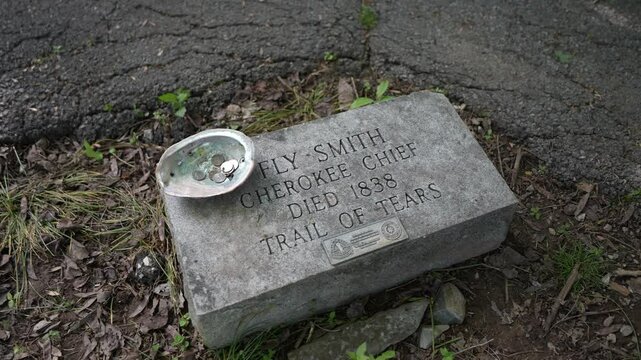 Hopkinsville, KY, USA - 04 26 2025: A memorial stone marks the grave of Fly Smith, a Cherokee Chief who died in 1838, located in a park commemorating the Trail of Tears near Hopkinsville, Kentucky.