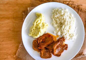 Classic rustic Brazilian food, beef tongue with rice and mashed potatoes. Real food