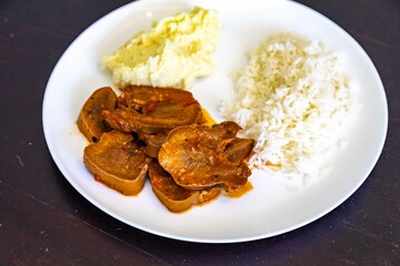 Classic rustic Brazilian food, beef tongue with rice and mashed potatoes. Real food