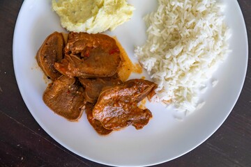 Classic rustic Brazilian food, beef tongue with rice and mashed potatoes. Real food