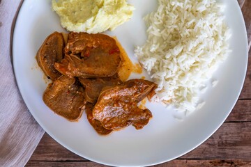 Classic rustic Brazilian food, beef tongue with rice and mashed potatoes. Real food