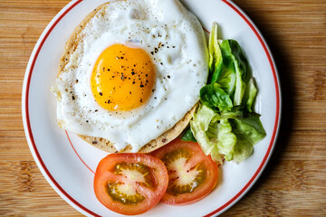 Healthy Fried Egg With Sllced Tomato And Lettuce