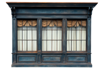 Decorative shop window with elegant curtains located in a vintage urban setting during daylight hours showcasing timeless architectural features