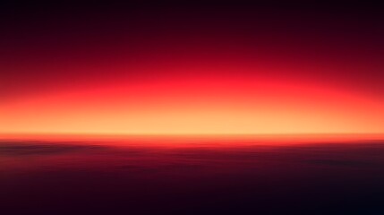 Obraz premium Dramatic red sunset over the horizon creating a surreal and otherworldly vista landscape