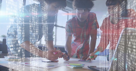 Collaborating professionals planning project in office, with charts, sticky notes and data overlay