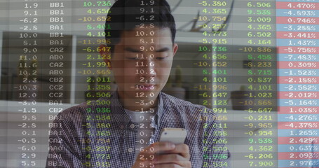 Checking Asian man monitoring stock market data on smartphone at office lounge, with ticker overlay