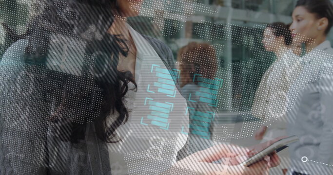 Woman in gray cardigan scanning dotted world map overlay in modern office lobby, holding smartphone