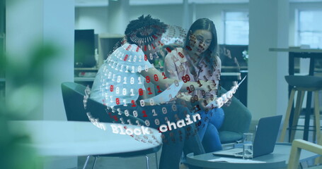 Discussing blockchain technology, diverse colleagues with digital binary globe overlay in office