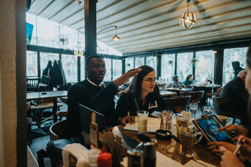 A diverse group of business professionals gathered in a modern cafe during a collaborative...