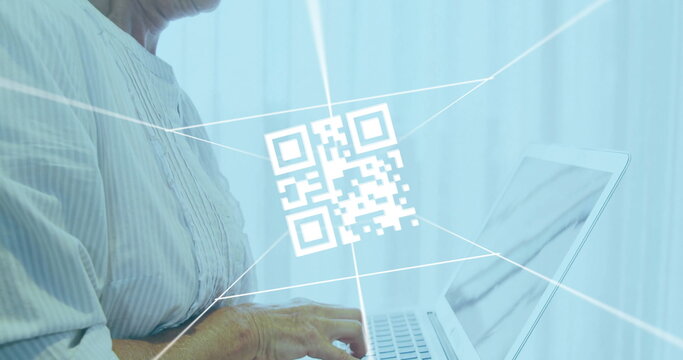 Typing striped-shirted woman on silver laptop at office, with floating QR code graphic, light beams