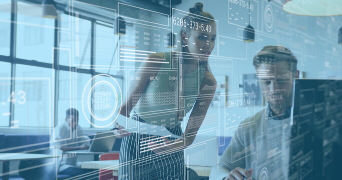 Teen girl in striped skirt and top manipulating digital interface overlays in office, with monitors