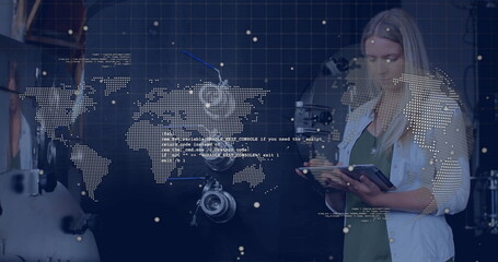 Woman using tablet with digital world map and data processing image